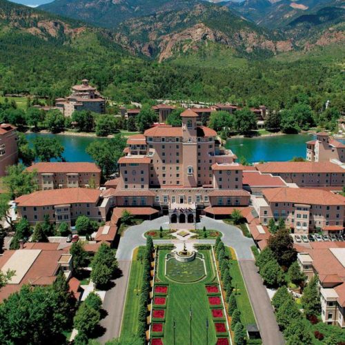Overview of the Broadmoor in Colorado Springs with mountains in the background
