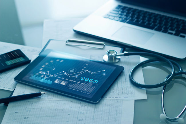 Healthcare business concept, Medical examination and growth graph data of business on tablet with doctor's health report clipboard on background.