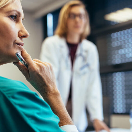 Female medical professional in staff meeting